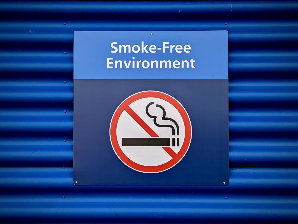 A no-smoking sign on the wall with the words 'smoke-free environment'