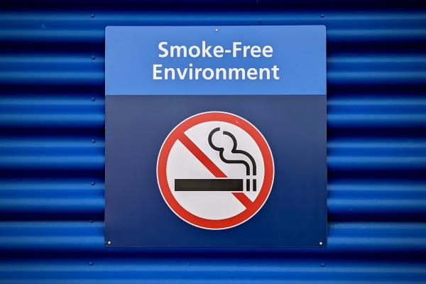 A no-smoking sign on the wall with the words 'smoke-free environment'